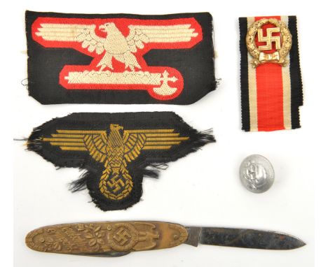 A German pen knife, the brass sideplate embossed on one side with a figure of Hitler, and on the other side with eagle and sw