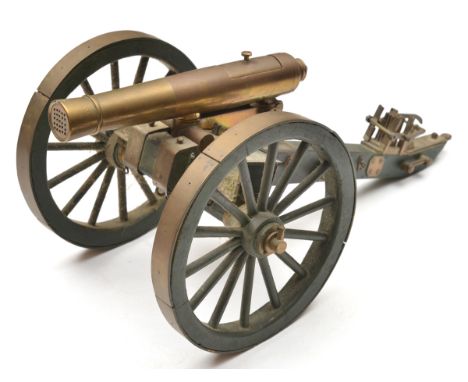 A well detailed brass and wooden scale model of a 25 shot cannon, 5x5 small bores with lift out breech block for loading, on 