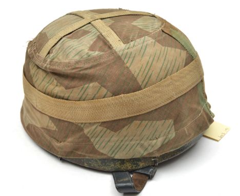 A WWII style German 2nd model double decal paratroopers helmet, the skull with smooth green finish over some deep pitting and