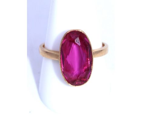 Russian 14ct Gold Oval Brilliant Cut Synthetic Pink Sapphire? ring. The Oval Brilliant Cut Synthetic Pink Sapphire? measures 