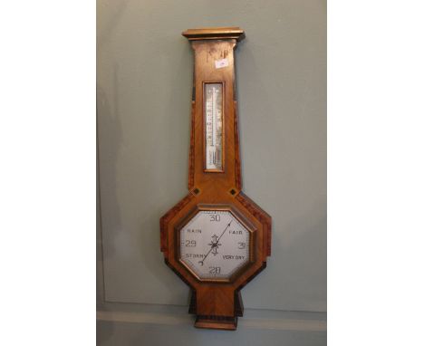 A 1930's Art Deco aneroid barometer in an inlaid walnut case 66cm high