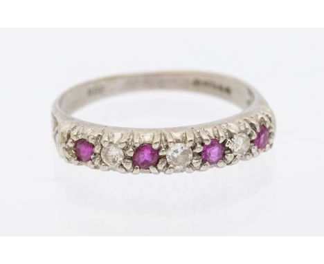 18ct White Gold Seven Stone Ruby & Diamond Half Eternity Ring.  The ring has three approx 0.02ct Round Brilliant Cut Diamonds