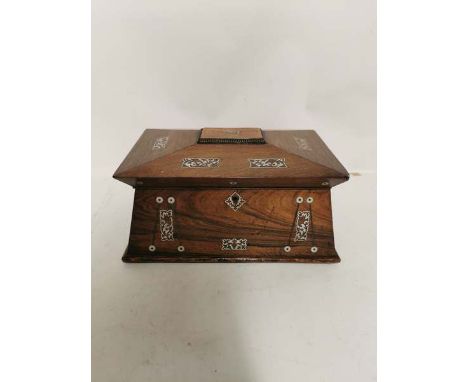 A mid 19th century Rosewood and mother of pearl in laid sarcophagus shaped tea caddy with 2 compartments and central glass mi