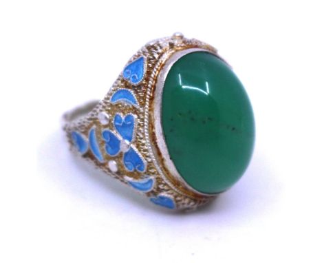 Unmarked White Metal Chrysoprase and Enamelled Ring.  The Green Oval Cabochon Chyrsoprase measures approx. 18mm x 13mm.  Ther