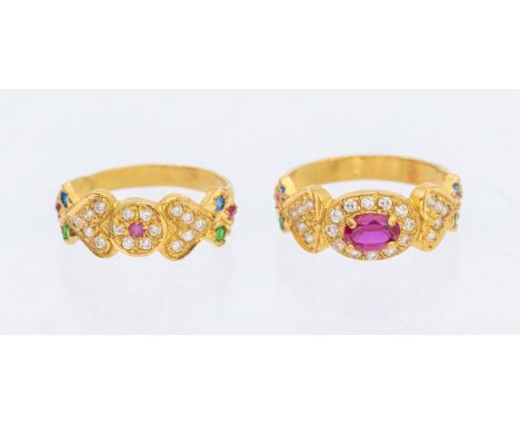 Two Unmarked Yellow Metal Dress Rings. One of the rings contains an Oval Brilliant Cut Synthetic Ruby that measures approx. 6