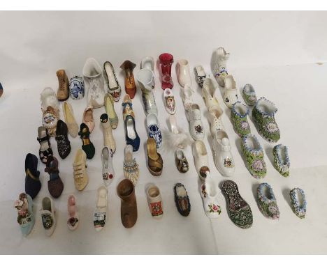 Over 100 collectors miniature model shoes, mostly ceramic to include; Beswick, Mossware, Just The Right Shoe, souvenir shoes,