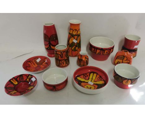 A collection of Poole pottery 'Delphis' pattern vases and bowls etc in oranges and reds. The two tallest vases being 22cm and