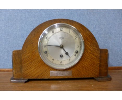 A Garrard oak mantel clock