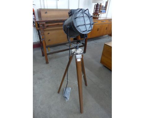 A theatre style light on tripod stand
