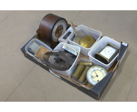 A box of clock and watch parts, mantel clock, carriage clock, weights, hands, etc.