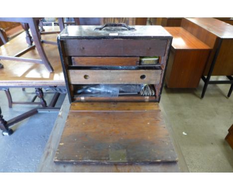 An engineer's tool box including tools