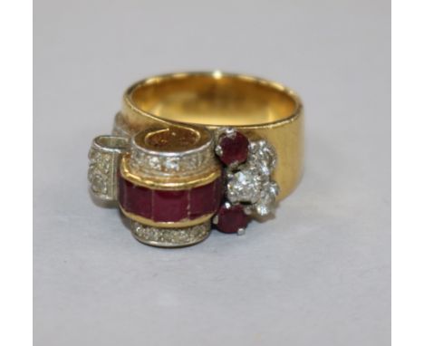 A 1950's? yellow metal, ruby and diamond cocktail ring, size I.