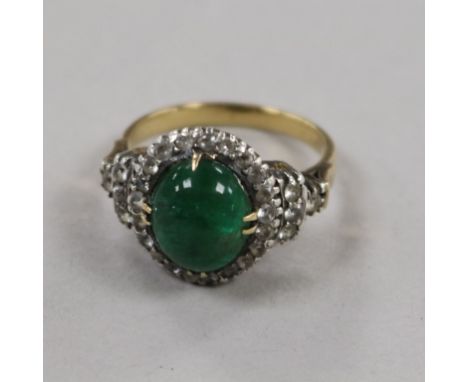 A yellow metal, cabochon emerald and white sapphire? cluster ring, size K.