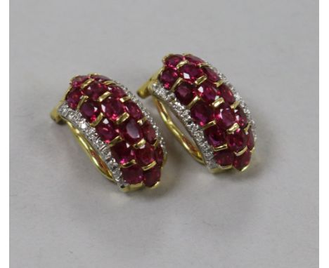A modern pair of 18ct gold, ruby and diamond cluster half hoop ear clips, 19mm.