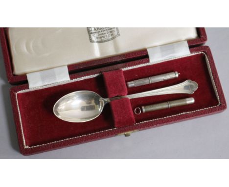 Two engine turned silver propelling toothpicks and a cased silver teaspoon.