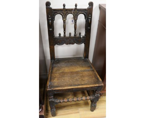 A 17th century Derbyshire wood seat dining chair, with bobbin turned underframe