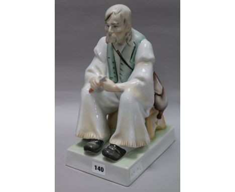 A Zsolnay ceramic figure of a gentleman, seated height 35cm