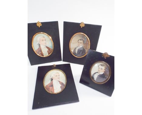 Group of four 19th century watercolour portrait miniatures in black ebonised frames, one on ivory with easel fitting