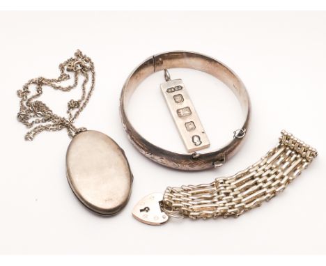 Collection of silver items to include ingot, gate bracelet, bangle and locket