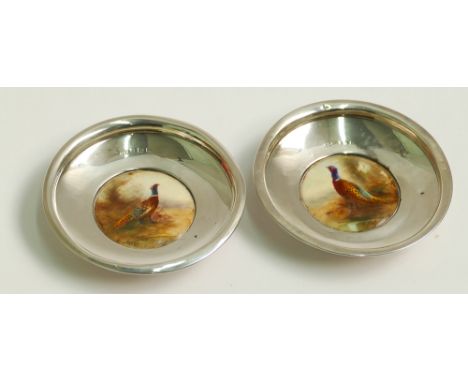 Pair of Edwardian silver pin trays , the centres inset with Royal Worcester plaques painted with pheasants and signed Jas -Ja