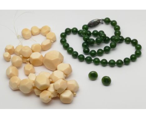 A row of 1920's faceted ivory beads and a string of green jade beads with silver clasp. Ivory weight 75 grams.