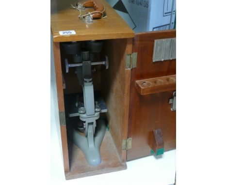 Laboratory microscope in wooden carry box 