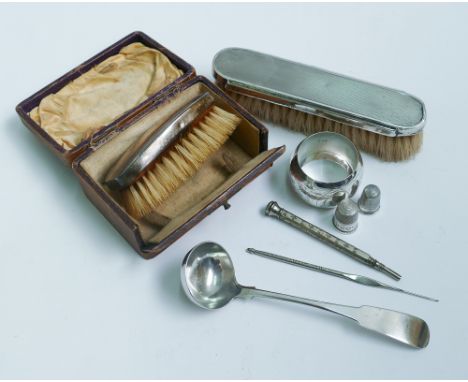 Collection of small silver ware to include thimbles, propelling pencils, sauce ladle, hairbrushes, napkin ring (8 items in th