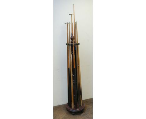Cue stand with 10 cues and 2 long handled bridges, set of snooker balls, marking board, brushes, triangles and other pieces 