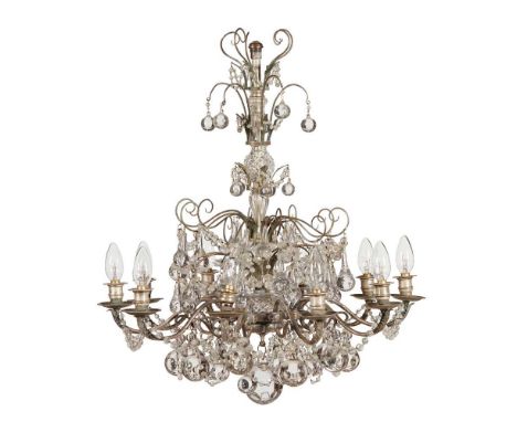 IRISH TEN LIGHT CRYSTAL AND SILVERED BRASS CHANDELIER 19TH CENTURY with ten scrolling candle arms hung with teardrops, sphere