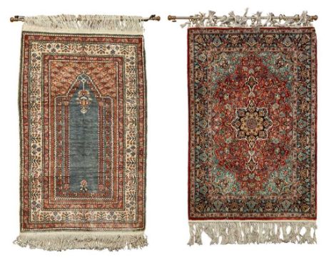 HEREKE SILK RUG WEST ANATOLIA, LATE 20TH CENTURY the rust red field with indigo medallion, light blue spandrels, within indig