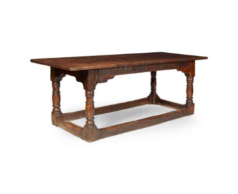 OAK 17TH CENTURY STYLE REFECTORY TABLE 20TH CENTURY the three board top with cleated ends above an arch carved frieze with in