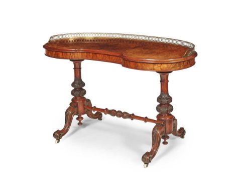 EARLY VICTORIAN WALNUT KIDNEY SHAPED WRITING TABLE MID 19TH CENTURY the reniform top with a pierced brass gallery, raised on 
