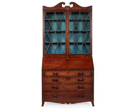 LATE GEORGIAN MAHOGANY BUREAU BOOKCASE EARLY 19TH CENTURY the swan neck pediment above a pair of astragal glazed doors enclos