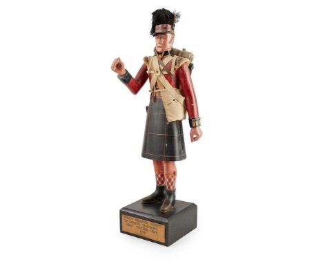 SCOTTISH CARVED, POLYCHROMED, AND TOLE TOBACCO FIGURE LATE 19TH/ EARLY 20TH CENTURY depicting a private grenadier from the 79