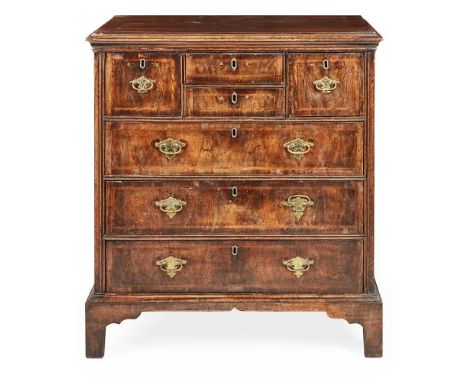GEORGE II WALNUT AND FEATHER BANDED CHEST OF DRAWERS MID 18TH CENTURY the moulded rectangular top above two central short dra