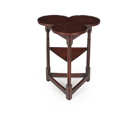 PROVINCIAL OAK TREFOIL SMALL TABLE LATE 18TH/ EARLY 19TH CENTURY the lobed top over a triangular undertier, raised on ring-tu