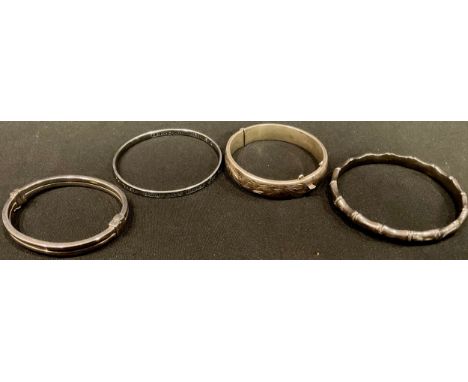 A silver hinge bangle, Birmingham 1964; others (4) 