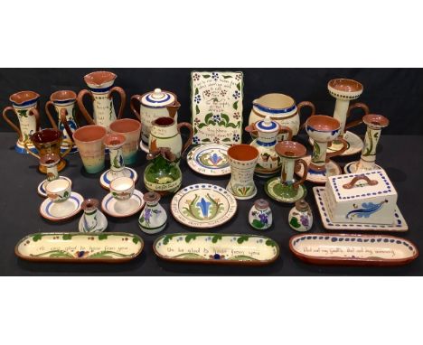 A collection of Devon Torquay mottoware, including plaque, candlesticks, cheese dish,  vases, etc, approx. 30 pieces 