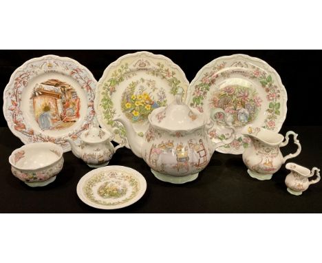 A Royal Doulton Brambly Hedge three piece tea service comprising teapot, cream jug and sugar bowl; others, miniature teapot, 