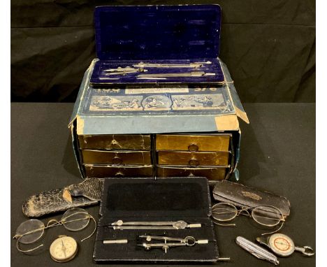 A pair of early 20th century gold plated spectacles, cased; another pair similar; two sets of steel draughtsman's instruments