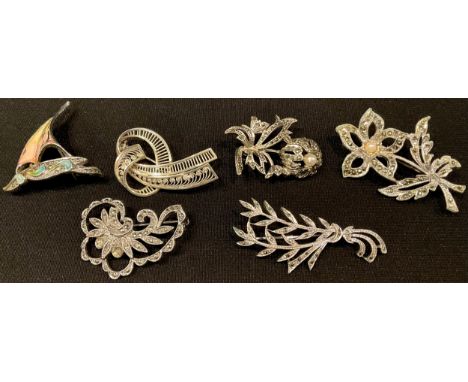 A sterling silver openwork filigree brooch; a silver brooch; three other brooches, enamel ship, marcasite (5) 