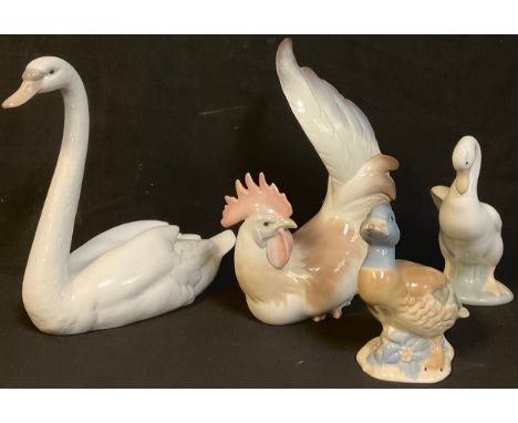 A Lladro model of a cockerel, a Lladro model of a swan; a Nao goose; another bird model (4) 