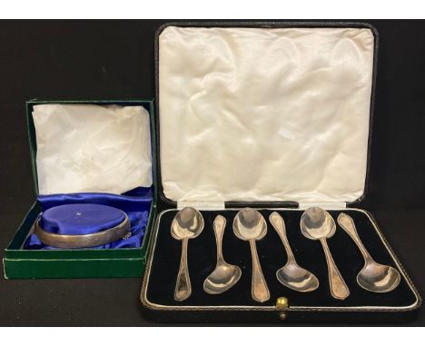 A set of six silver teaspoons, Sheffield 1930, cased; a silver bangle, Birmingham 1979, boxed; 111g 