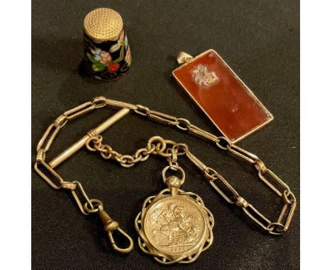 A Victorian Albert; a carnelian pendant; an enamel thimble 