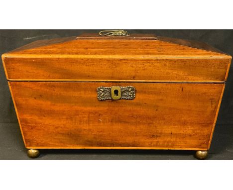 A George III mahogany sarcophagus shaped tea caddy, outlined with boxwood stringing, brass escutcheon, four brass ball feet, 