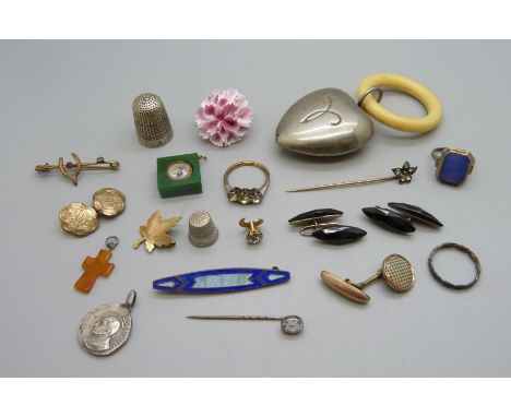 Assorted items including a teething ring, stick pins, ring, a compass charm, etc. 