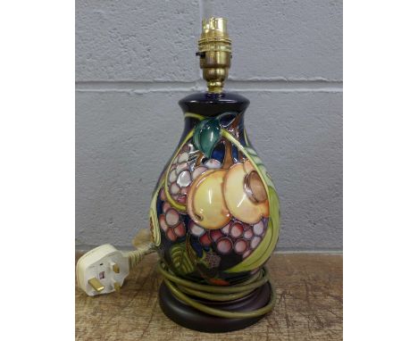 A Moorcroft Queens Choice table lamp base by Emma Bossons, baluster form on a wooden base, 26cm tall to the light fitting 