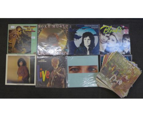 A collection of over thirty LP records, including Stevie Wonder 1962-1974, Roxy Music, Blondie, Smokey Robinson, Marc Bolan, 