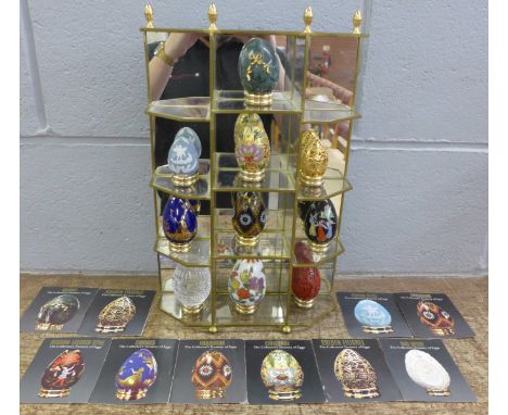 A collection of ten Franklin Mint The Collector's Treasury of Eggs, display cabinet and certificates 