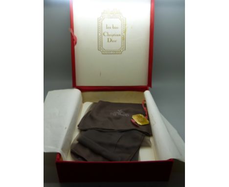 A vintage Christian Dior box and a pair of silk stockings 
